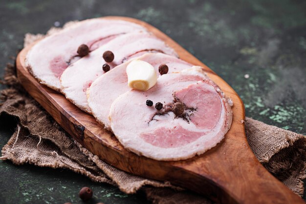 Slices of bacon with pepper and garlic 