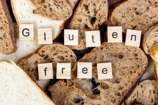 Photo slices of bread and gluten free sign text close-up