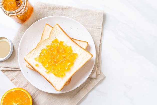 Slices of bread with orange jam