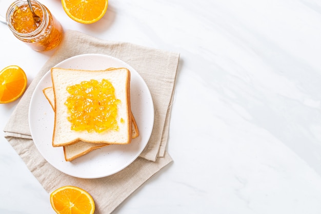 Slices of bread with orange jam