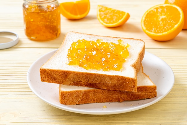 Slices of bread with orange jam 