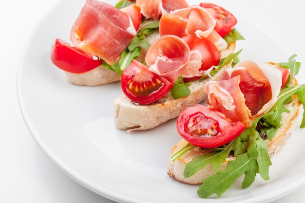 Slices of Bread with Spanish Serrano Ham Served as Tapas