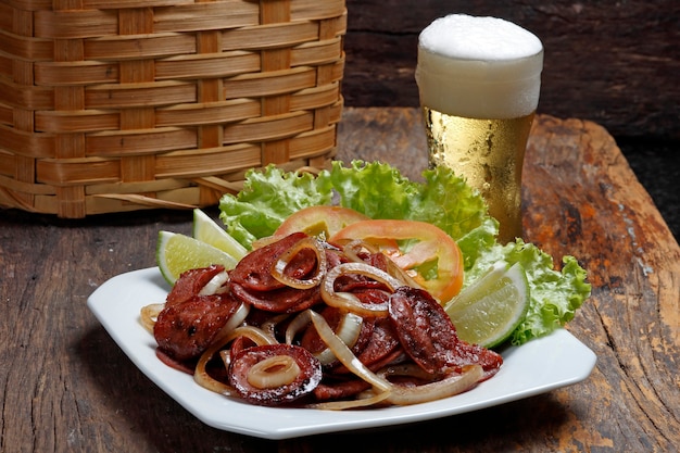 Slices of Calabrian Sausage and Cold Beer