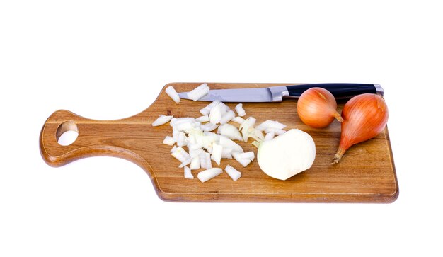 Slices of chopped onion on kitchen cutting board. 