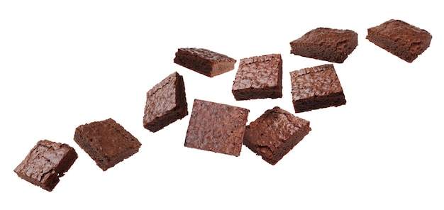 Slices of delicious chocolate brownie flying on white background Banner design