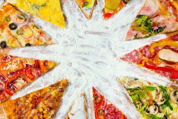 Photo slices of different types of pizza on white background