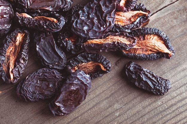 Slices of dried plums closeup on a table