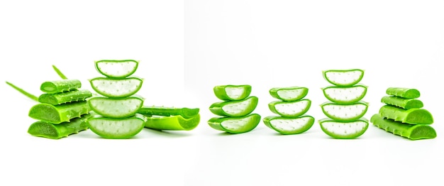 Slices of fresh aloe vera plant stacked on white background.