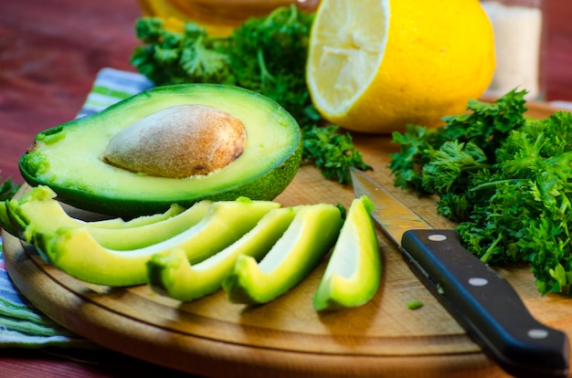 Slices of fresh avocado on a cutting board