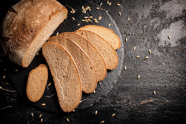 Slices of fresh bread on a stone board