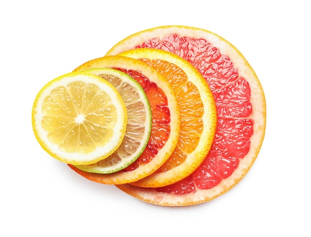 Slices of fresh citrus fruits on white background top view