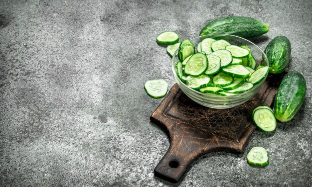 Slices of fresh cucumbers in a bowl.