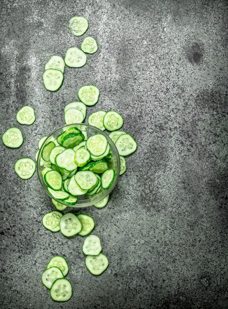 Slices of fresh cucumbers in a bowl.