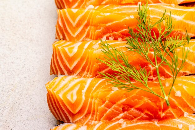 Slices of fresh salmon. Ingredient for cooking healthy seafood.