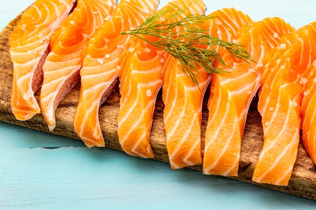 Slices of fresh salmon. Ingredient for cooking healthy seafood.