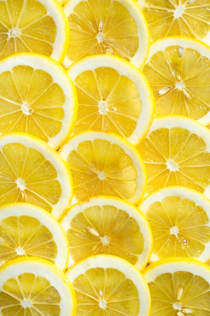 A slices of fresh yellow lemon texture background pattern