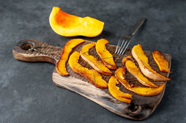 slices of fried pumpkin on a cutting board