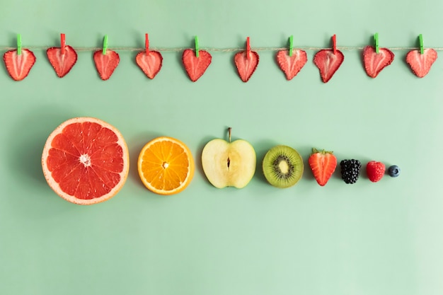 Photo slices of fruits and berries from large to small