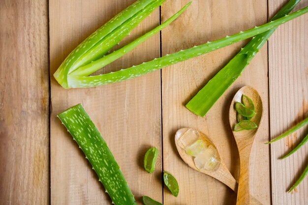 Slices gels and leaves of aloe vera on the table