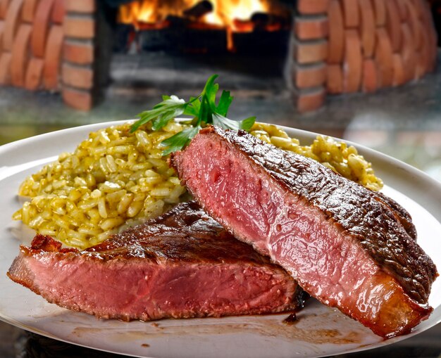 Slices of grilled filet with risotto