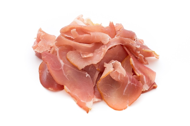 Slices of ham on white surface.