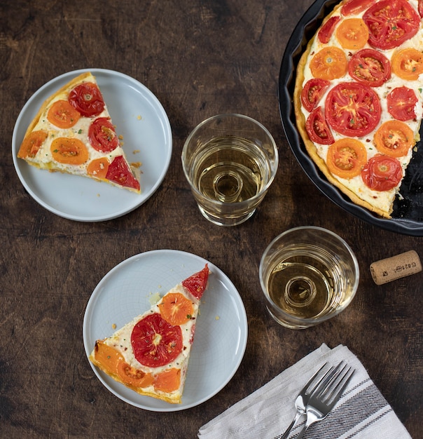 Slices of homemade pie with tomatoes and ricotta