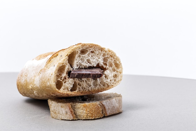 slices of homemade seed bread with a chocolate bar from above