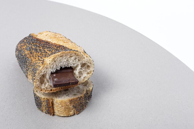 slices of homemade seed bread with a chocolate bar from above