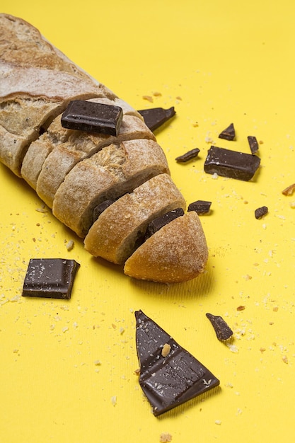 Slices of Homemade Seed Bread with a chocolate bar from above