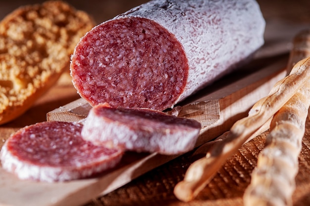 Slices of Italian salami with breadstick