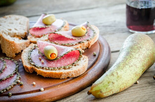 Slices of italian salami with pears