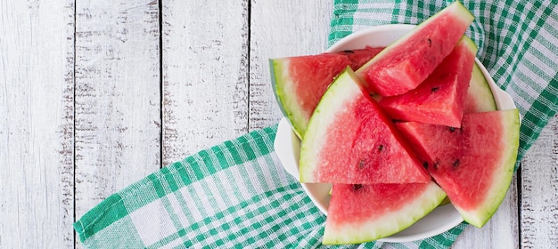 Slices of juicy and tasty watermelon on a white plate