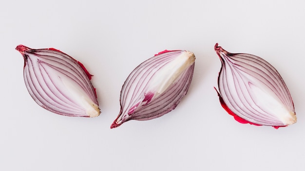 Photo slices of onion on white background