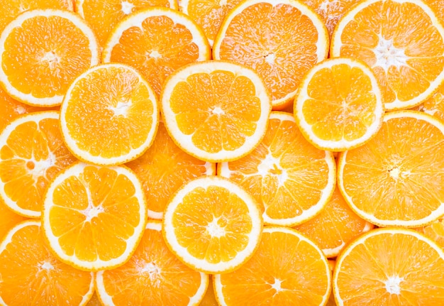 Photo slices of orange citrus fruit background