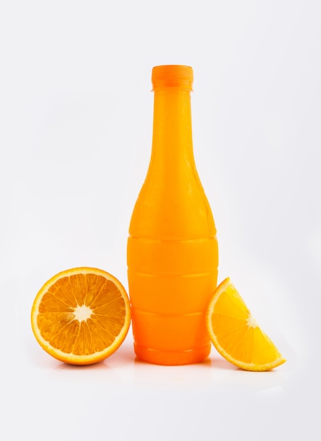 Slices of orange, orange juice in bottled on white background.
