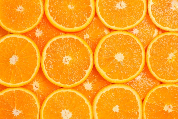 Slices of oranges as a background top view