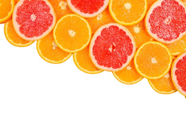 Slices of oranges and a grapefruits as a background