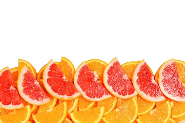 Photo slices of oranges and a grapefruits as a background