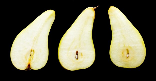 Slices of pears on a black background