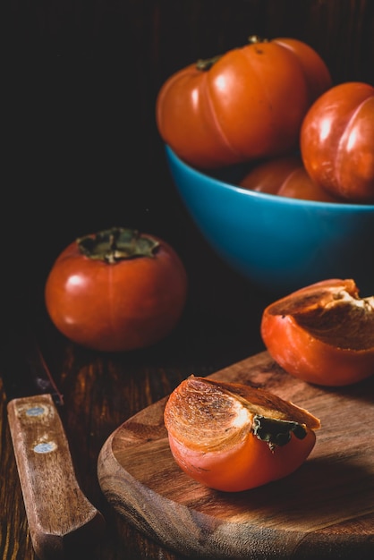 Slices of persimmon on cutting board