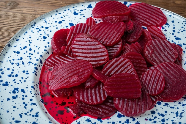 Slices of pickled red beets on a plate