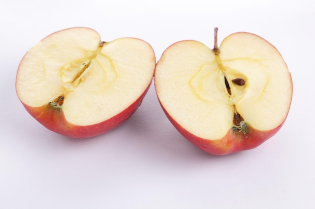 Slices of red fresh apple on a white background. Apples for juicing