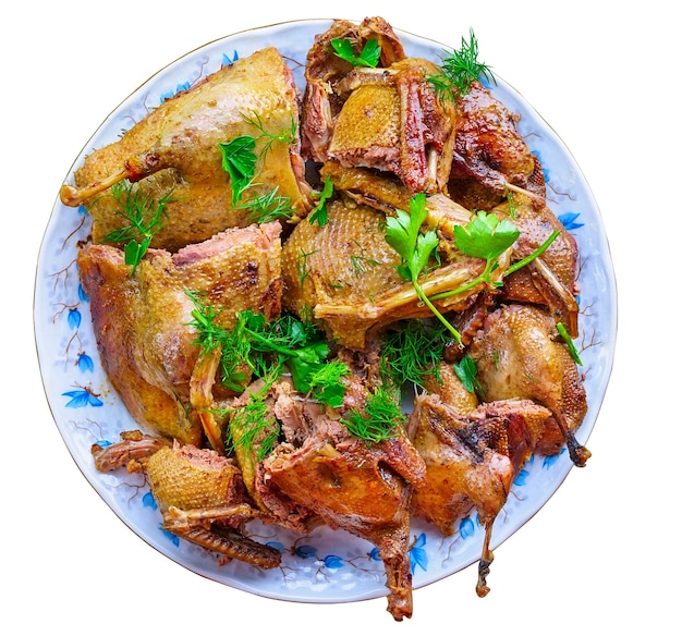 Slices of roasted wild duck on a round plate.