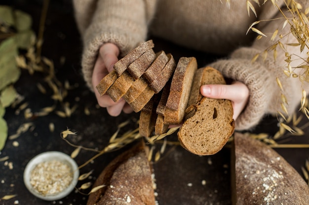 Slices of rye bread in childrens hands