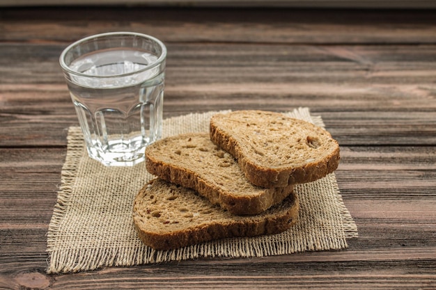 Slices of rye bread on a wooden background