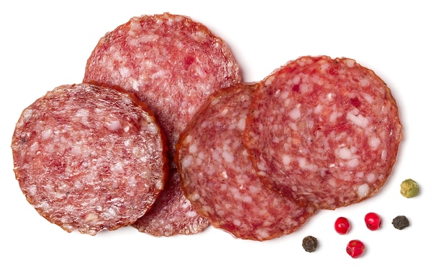 Slices of salami isolated on white background closeup Sausage top view