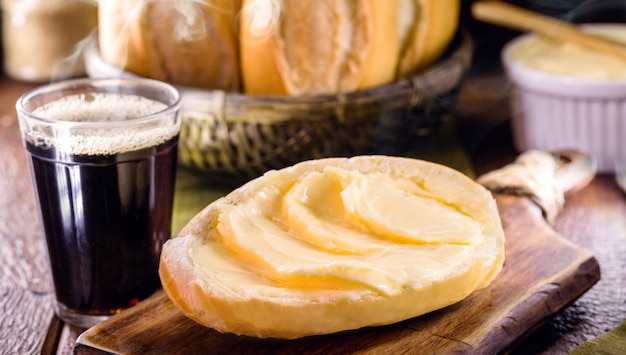 Slices of savory Brazilian bread called French bread served hot with coffee and lots of butter