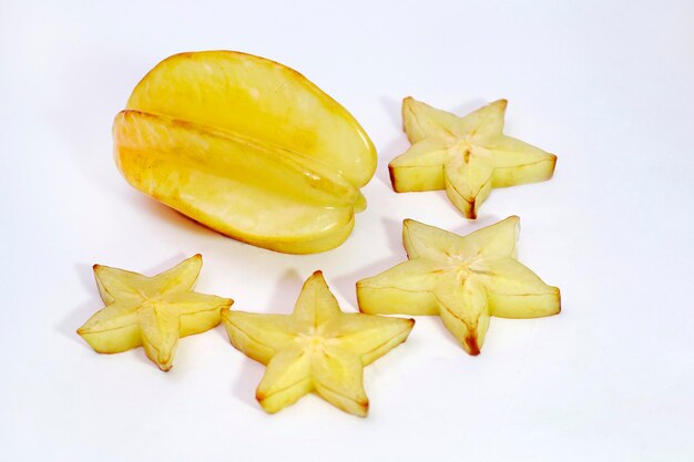 Photo slices of star fruit isolated on white background