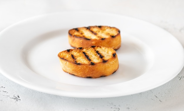 Slices of toasted bread on the serving plate