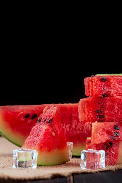 Slices of watermelon on tray on napkin 